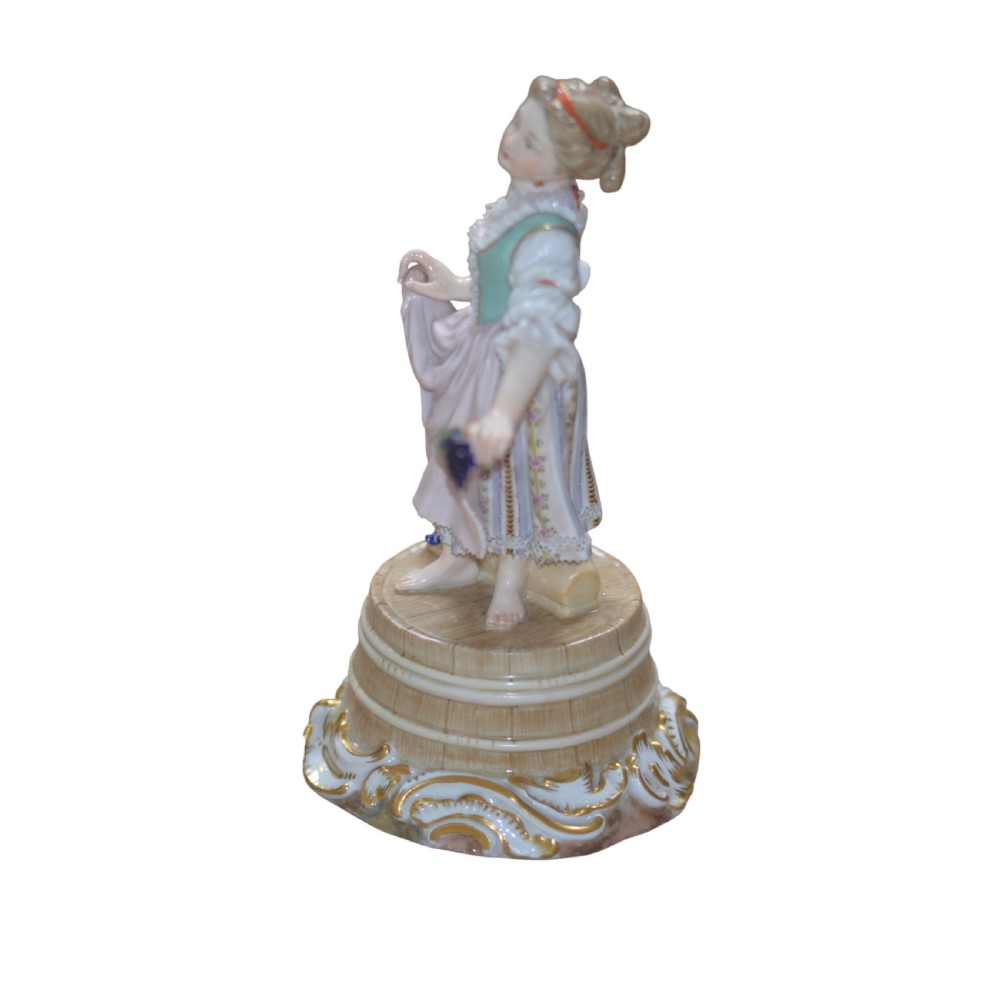meissen porcelain figure of a girl holding grapes